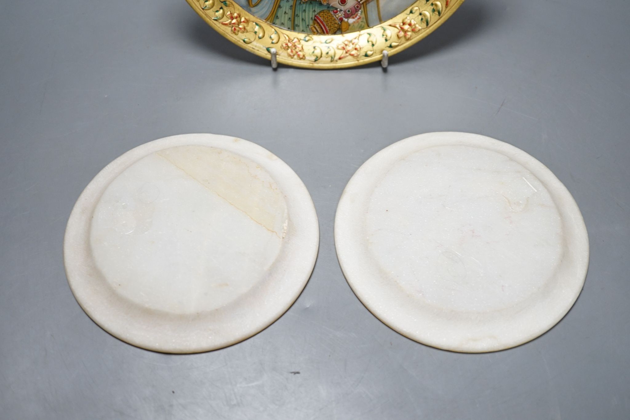 Three Indian alabaster, gilt bordered plates depicting Indian Royalty, 22cm